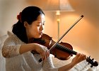 Haejin Kim-violinist--FIN  Haejin Kim practices her violin at her home in Greer Friday afternoon, 3-25-05. Kim has been chosen to perform at Carnegie Hall in New York on April 16.  (NOTE: Amanda Ridley story)